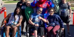 Group gathered for the inaugural Buzzy's Race for Research organized by Shenandoah University physical therapy students in April 2024. Group includes wheelchair users who "rolled" at the event, which benefits The Foundation for Physical Therapy research awards